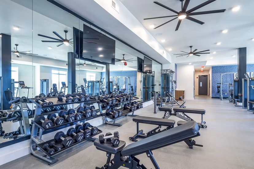 Fitness center with modern equipment at The Waterview Apartments