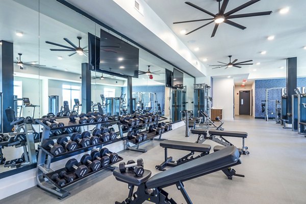 Fitness center with modern equipment at The Waterview Apartments