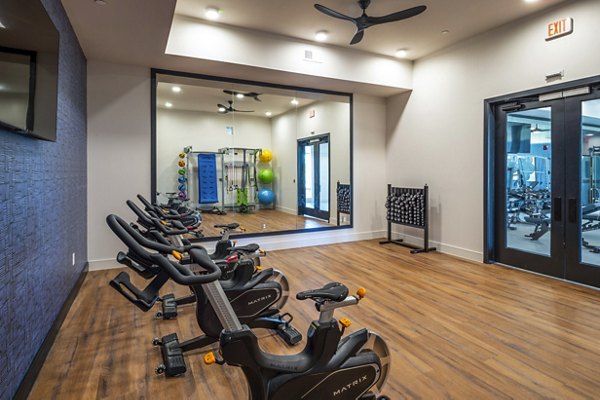 Yoga and spin studio with modern equipment at The Waterview Apartments