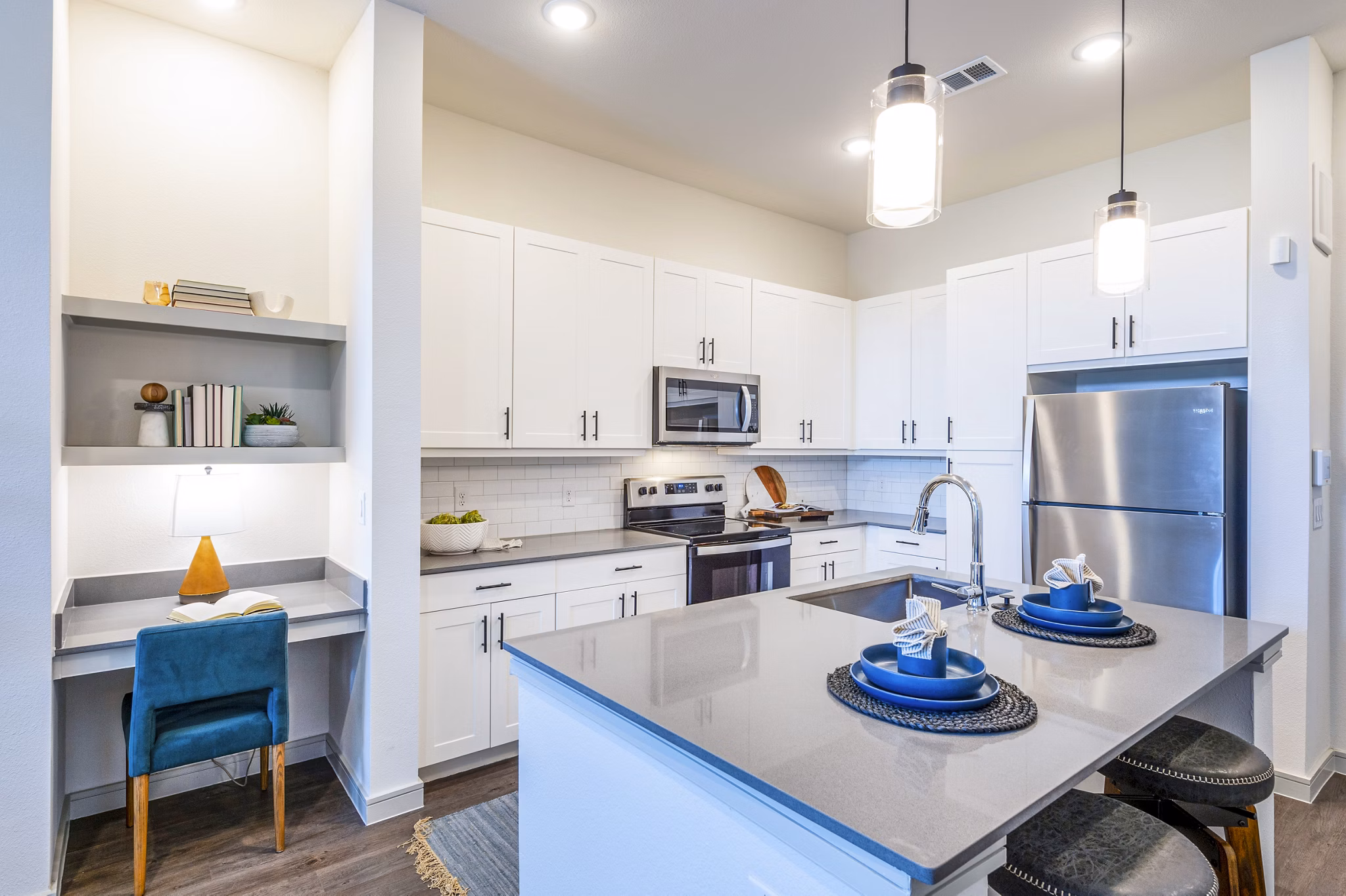Modern kitchen with stainless steel appliances at The Waterview Apartments
