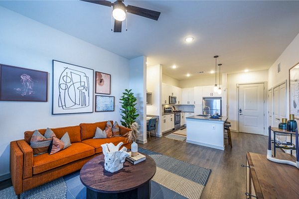 Contemporary living room with elegant decor and city views at The Waterview Apartments