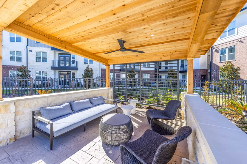 Outdoor patio with BBQ grill at The Waterview Apartments, a luxury community by Greystar