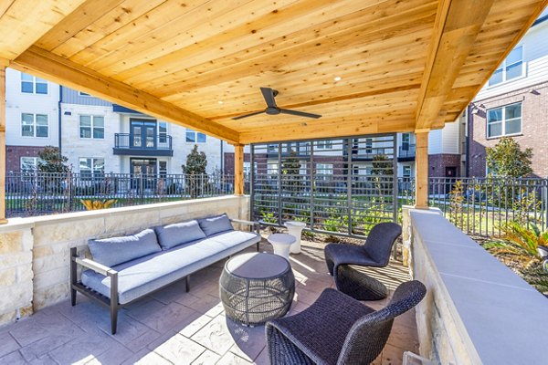 Outdoor patio with BBQ grill at The Waterview Apartments, a luxury community by Greystar