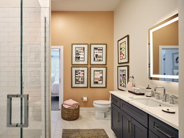 Modern bathroom with sleek fixtures at Icon Riverwalk apartments, luxury living by the waterfront