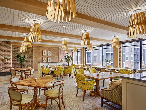 Elegant dining room with contemporary decor in Icon Riverwalk Apartments clubhouse
