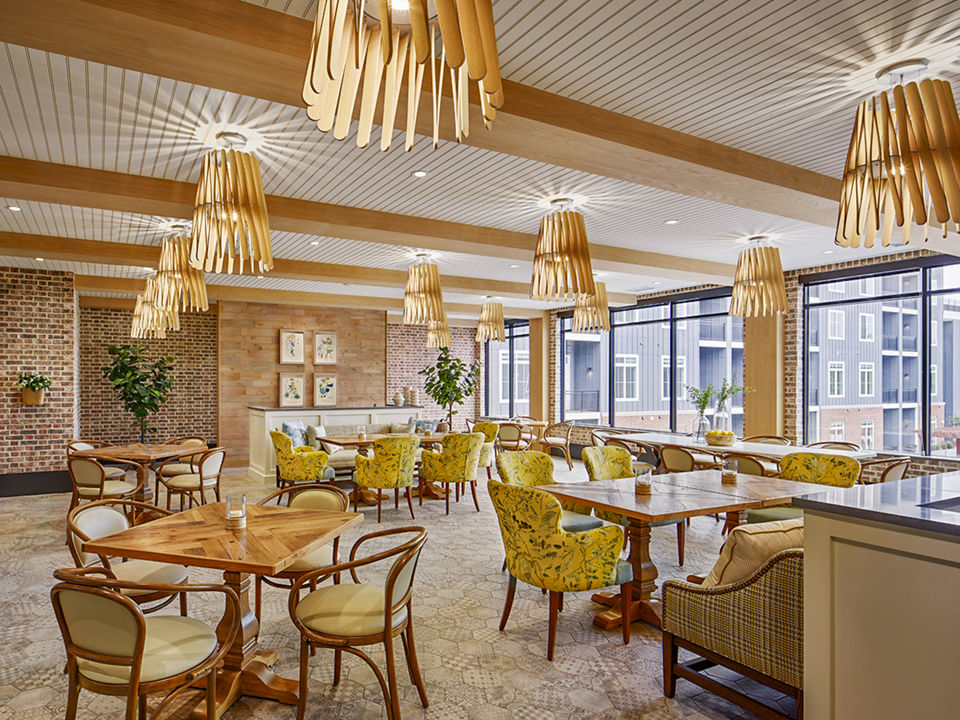 Elegant dining room with contemporary decor in Icon Riverwalk Apartments clubhouse