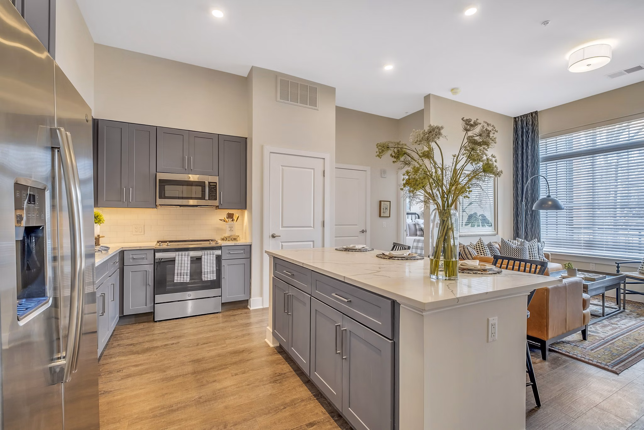 Modern kitchen with stainless steel appliances at Icon Riverwalk Apartments