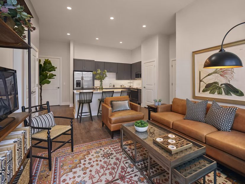 Spacious living room with river view at Icon Riverwalk Apartments, luxury property by Greystar