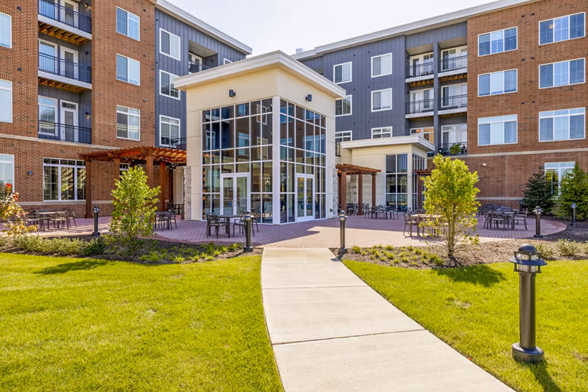 Outdoor patio with modern seating at Icon Riverwalk Apartments offering a relaxing space in a luxury setting