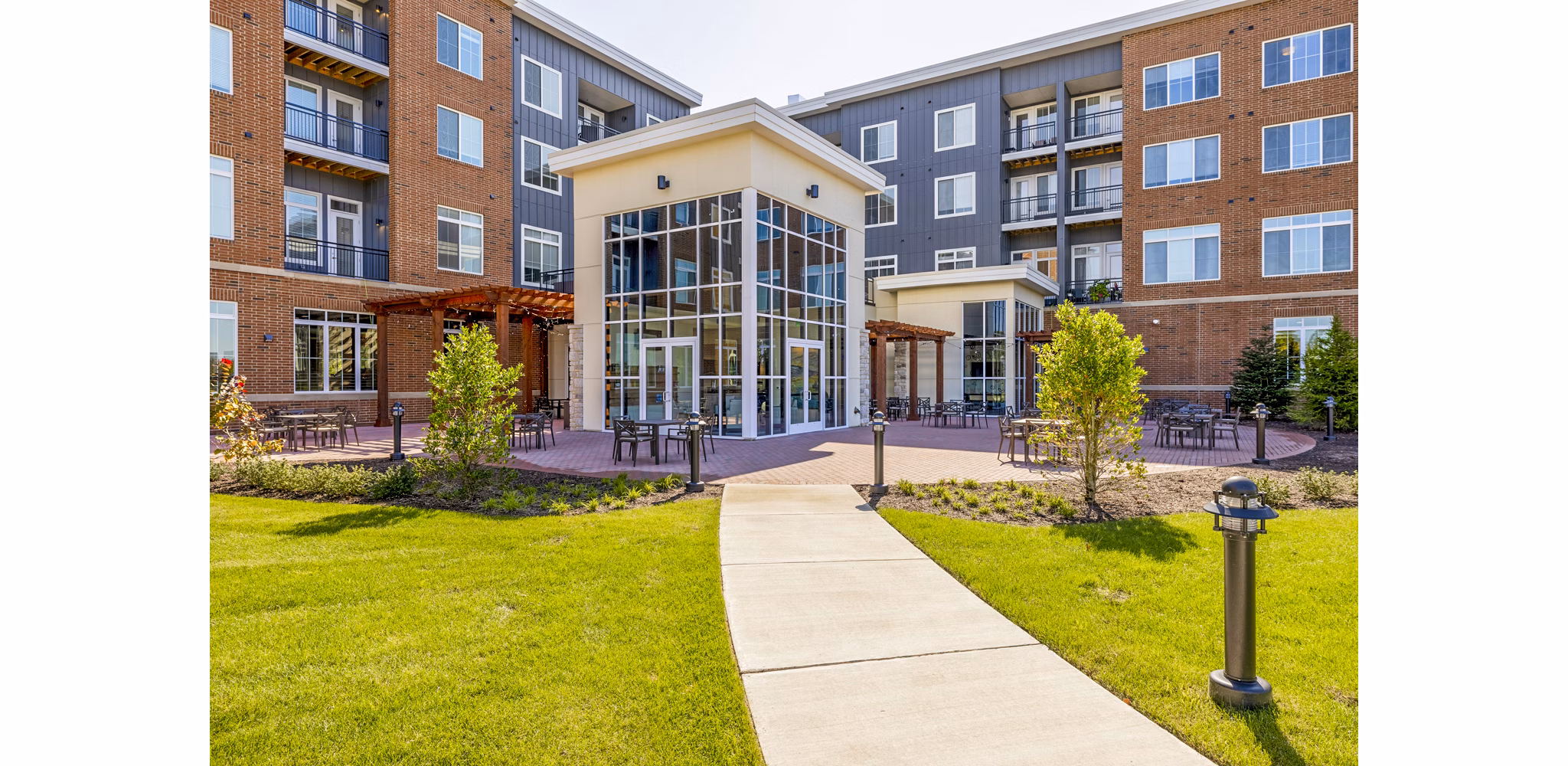 Outdoor patio with modern seating at Icon Riverwalk Apartments offering a relaxing space in a luxury setting