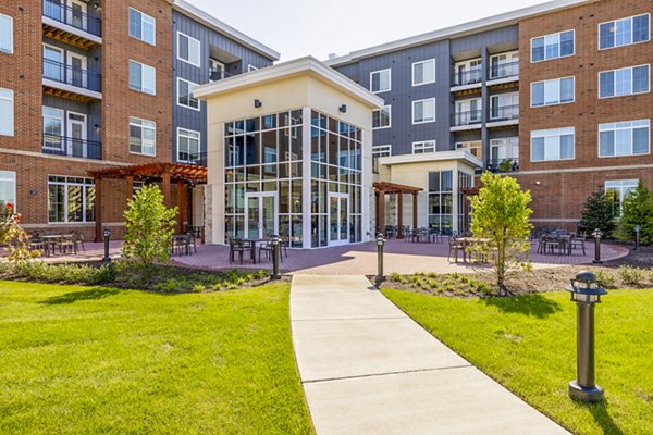 Outdoor patio with modern seating at Icon Riverwalk Apartments offering a relaxing space in a luxury setting