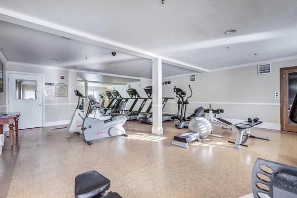 fitness center at River Oaks Apartment & Suites Apartments