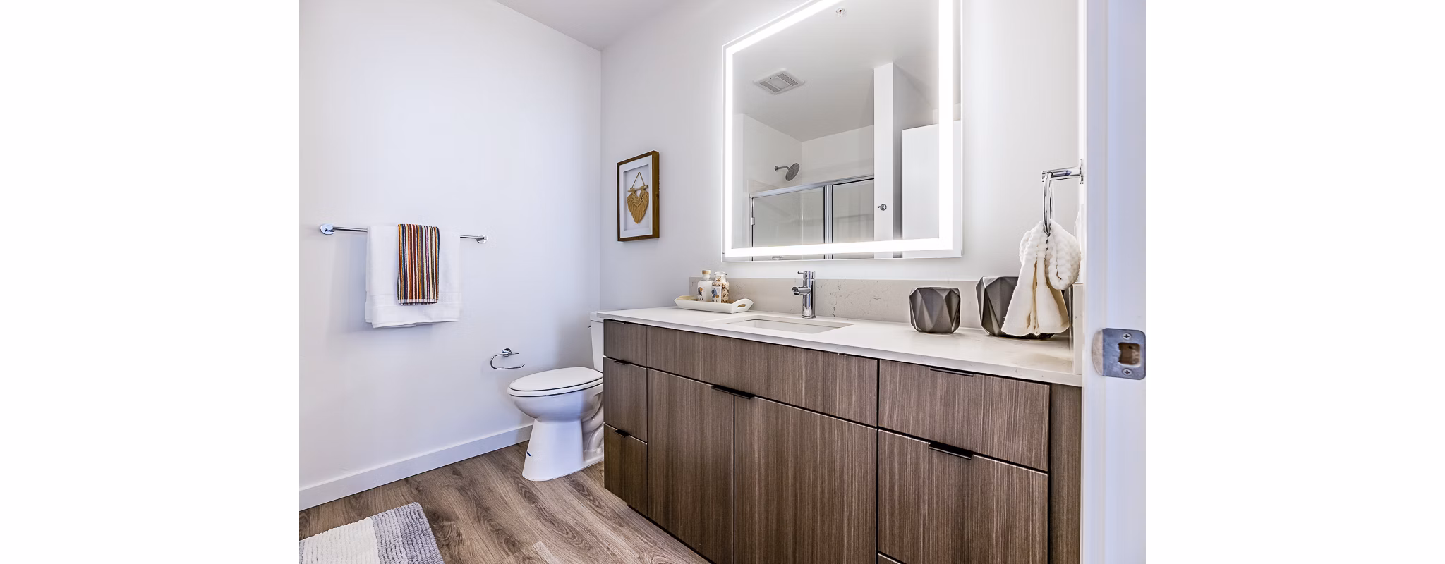 Bathroom featuring modern fixtures and sleek design at Mason & Main Apartments