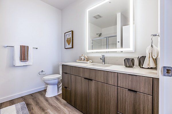 Bathroom featuring modern fixtures and sleek design at Mason & Main Apartments