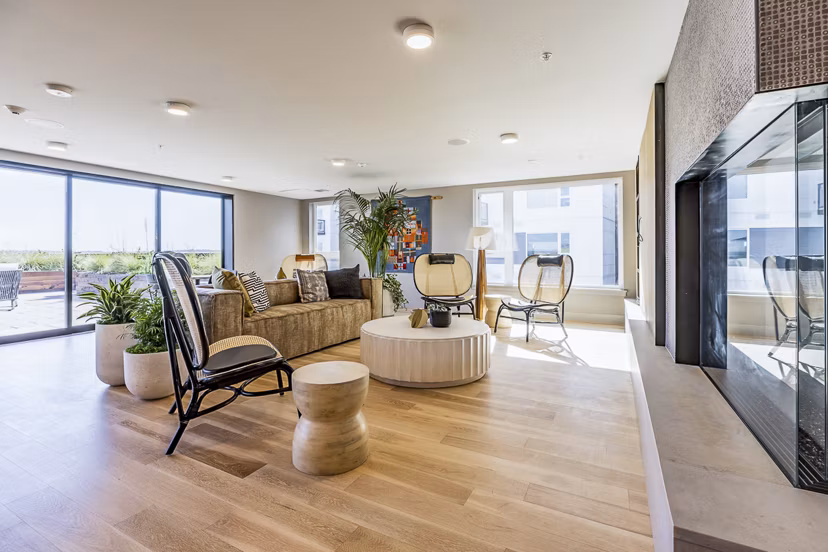 Spacious clubhouse with modern furnishings at Mason & Main Apartments, perfect for community gatherings and social events