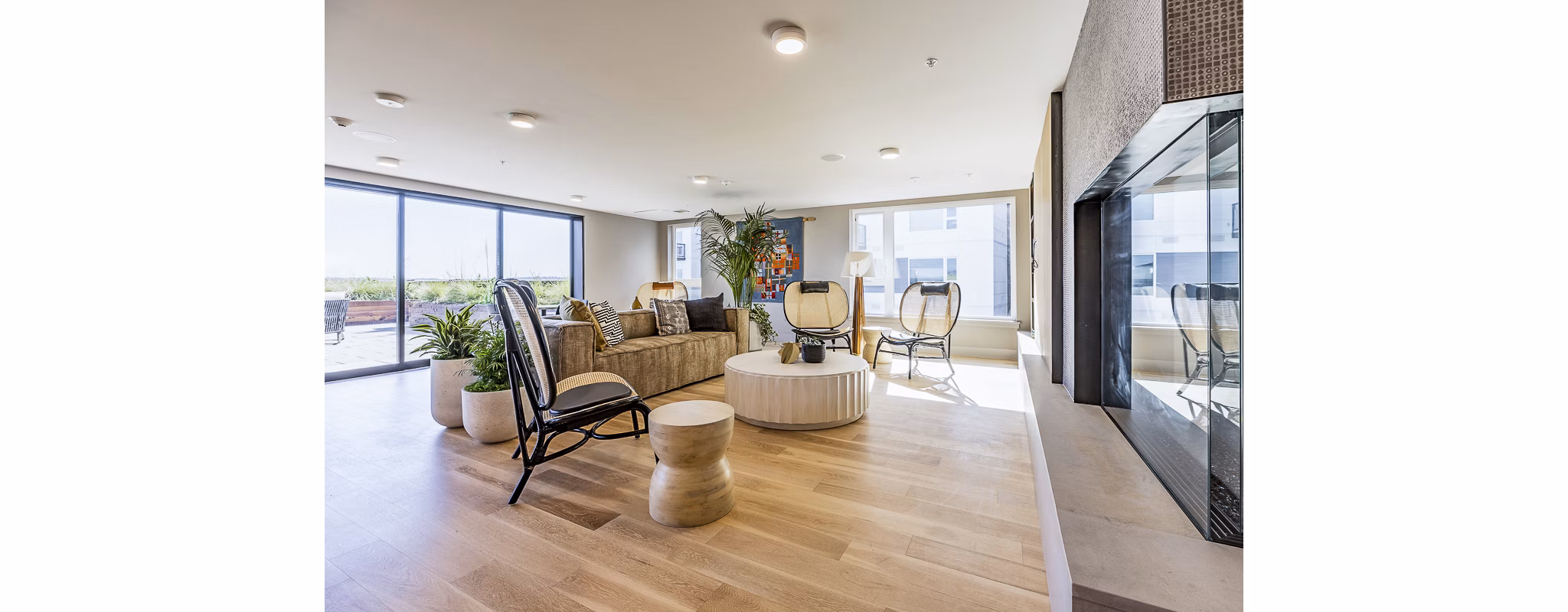 Spacious clubhouse with modern furnishings at Mason & Main Apartments, perfect for community gatherings and social events