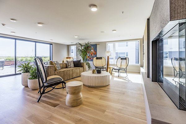 Spacious clubhouse with modern furnishings at Mason & Main Apartments, perfect for community gatherings and social events