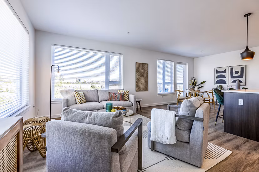 Modern living room with stylish furnishings at Mason & Main Apartments, showcasing luxury living in an urban setting