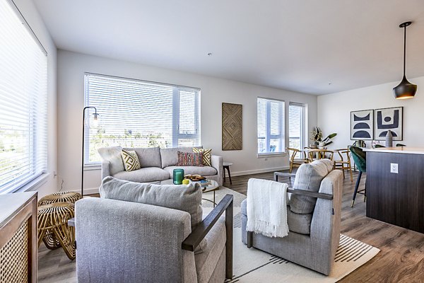 Modern living room with stylish furnishings at Mason & Main Apartments, showcasing luxury living in an urban setting