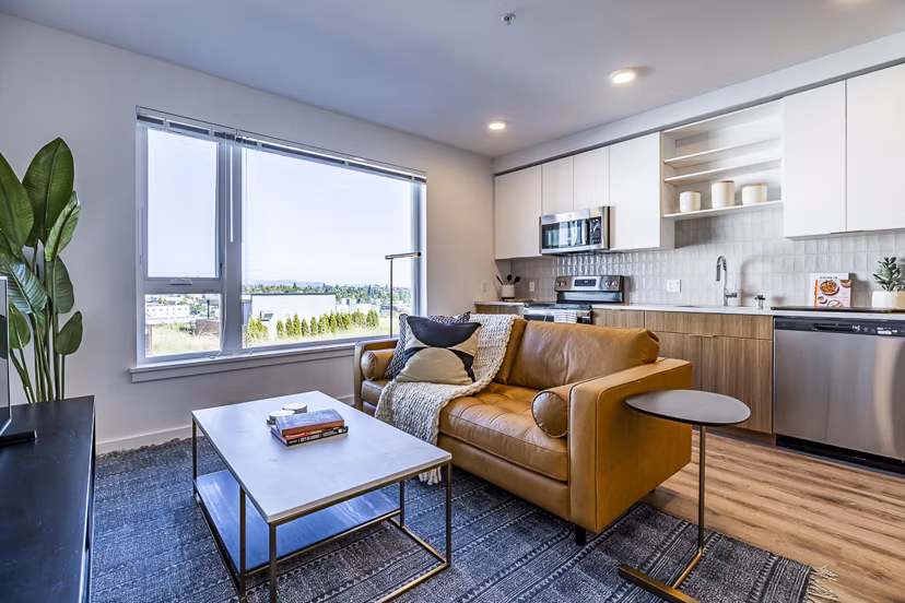 Spacious living room with chic modern decor in Mason & Main Apartments
