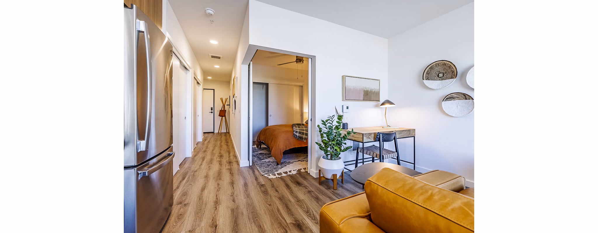 Spacious living room with modern furnishings in Mason & Main Apartments Perfect blend of comfort and style for luxury apartment living