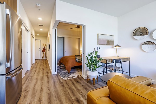 Spacious living room with modern furnishings in Mason & Main Apartments Perfect blend of comfort and style for luxury apartment living