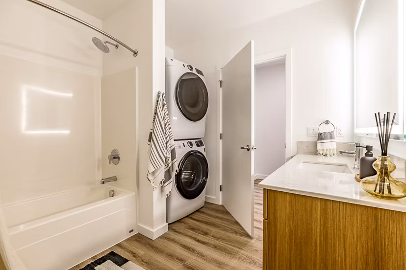 Bath and laundry room with modern fixtures at Mason & Main Apartments