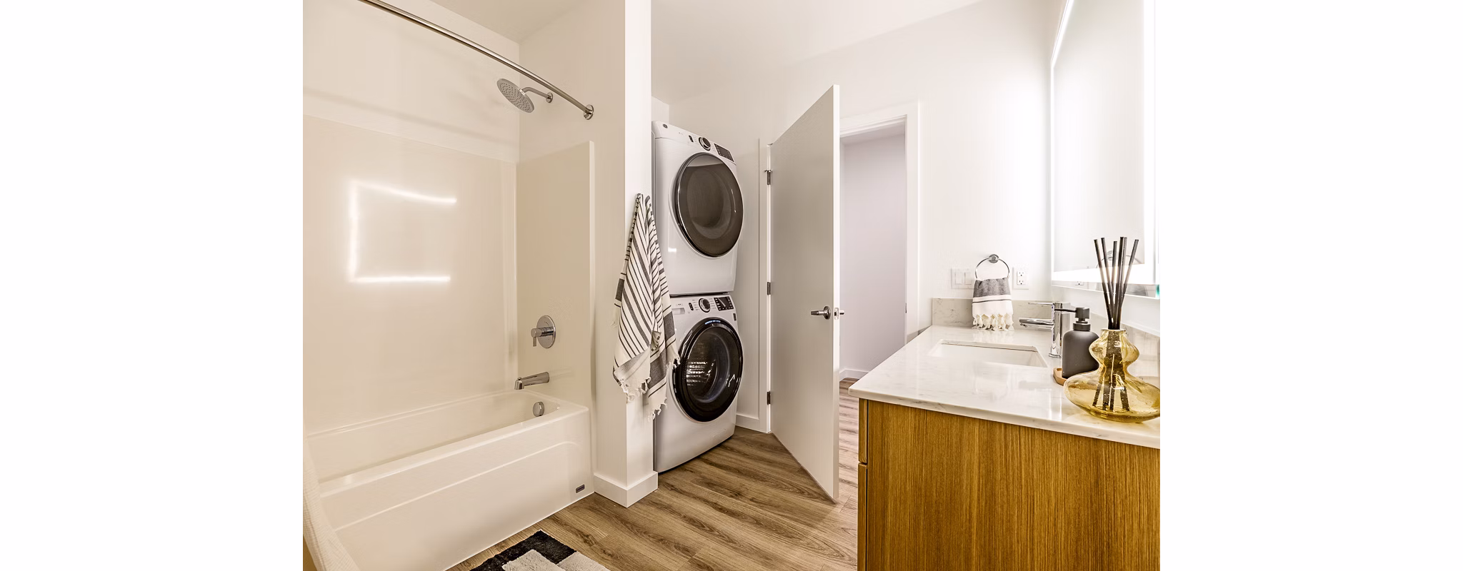 Bath and laundry room with modern fixtures at Mason & Main Apartments