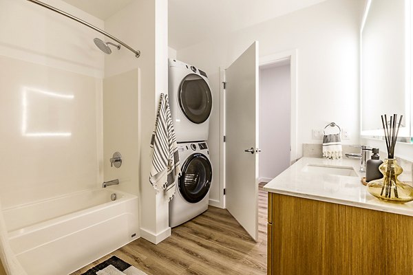 bath and laundry room at Mason & Main Apartments