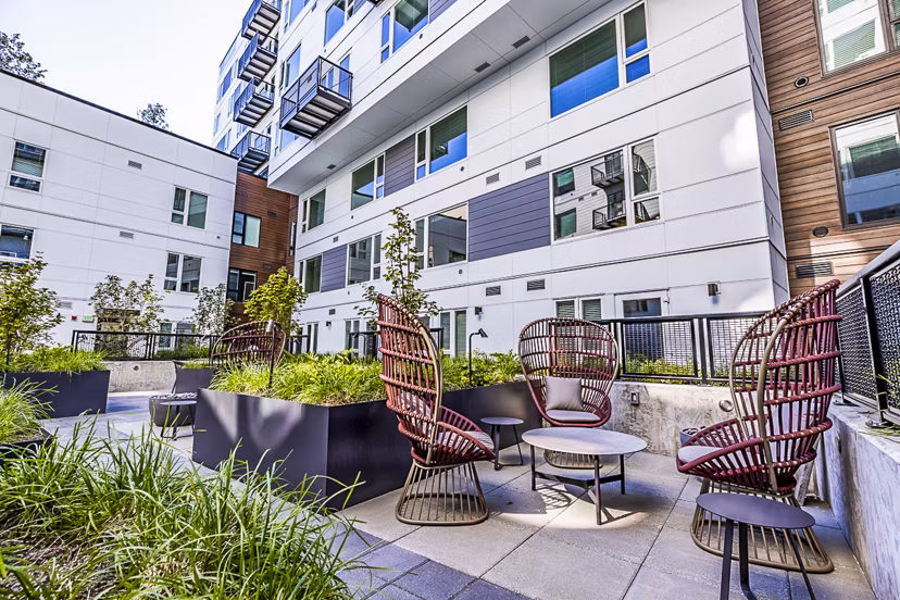 Spacious outdoor patio with modern seating at Mason & Main Apartments