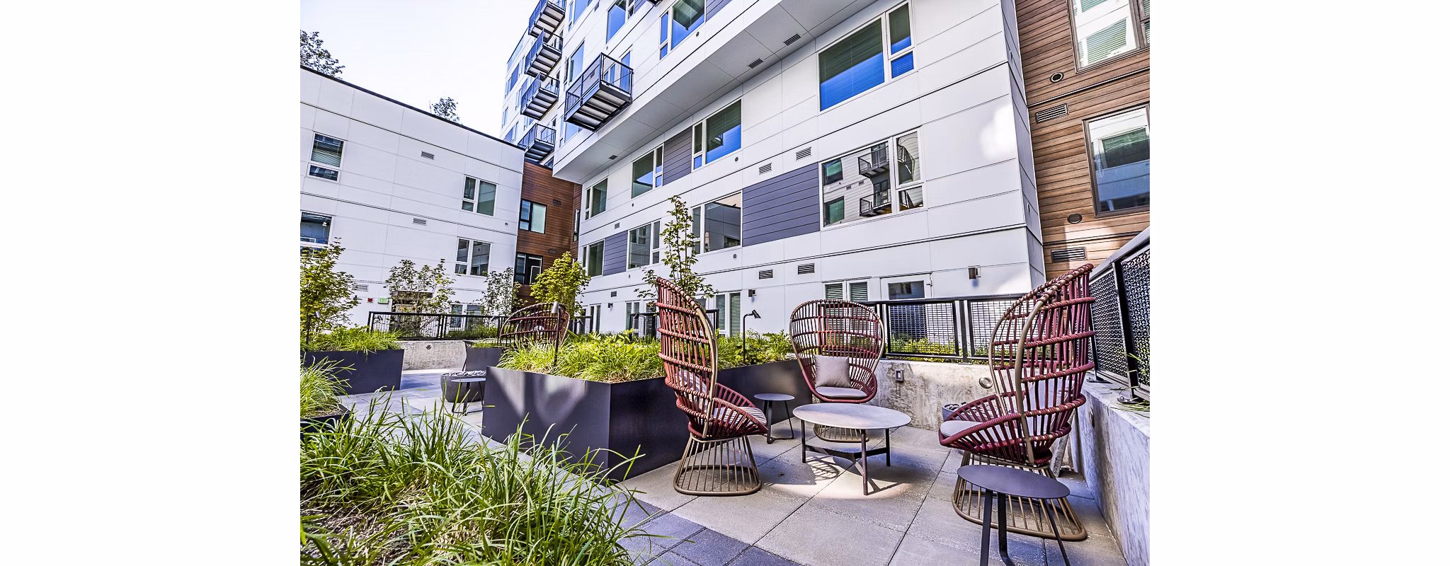 Spacious outdoor patio with modern seating at Mason & Main Apartments
