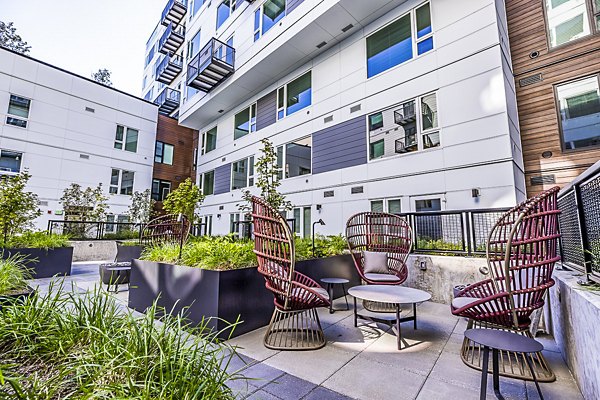 Spacious outdoor patio with modern seating at Mason & Main Apartments
