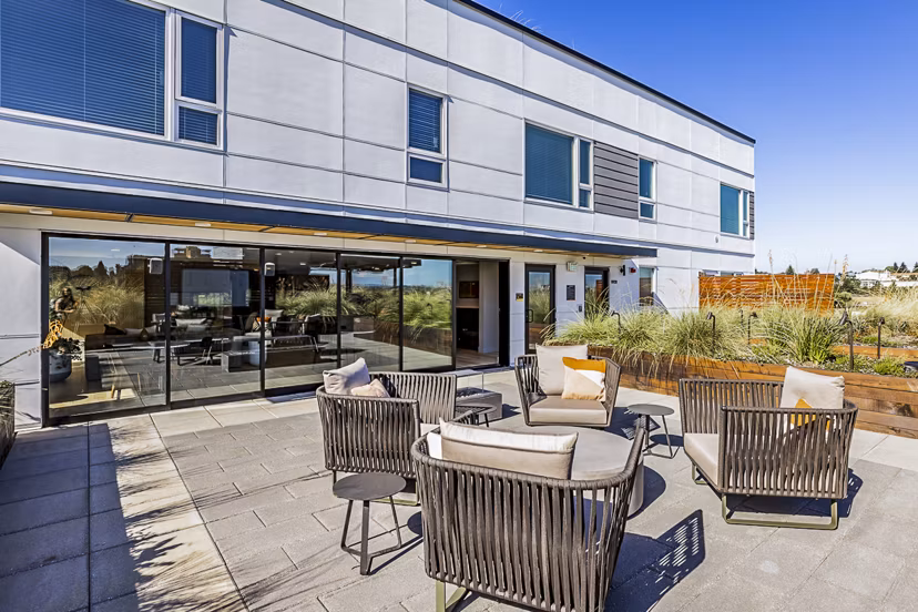 Outdoor patio area with stylish seating at Mason & Main Apartments