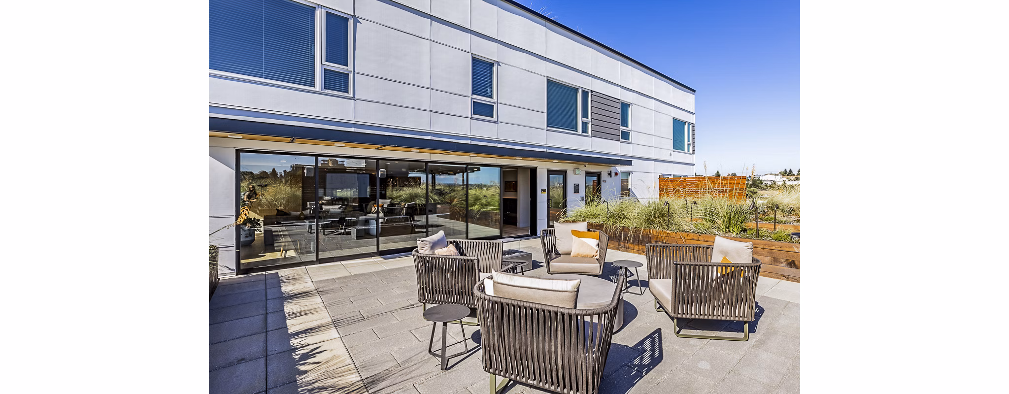 Outdoor patio area with stylish seating at Mason & Main Apartments