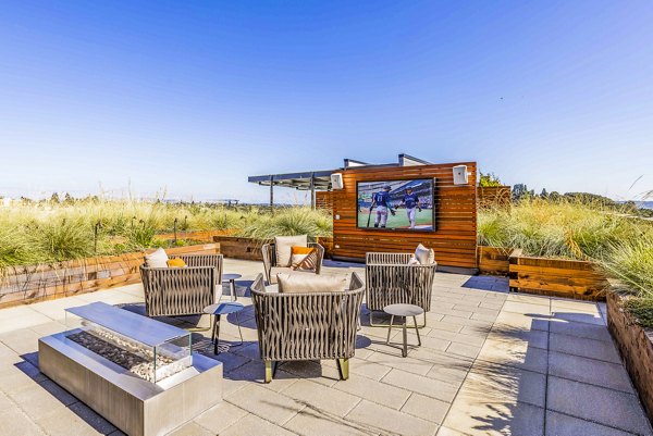 Modern outdoor patio with cozy seating at Mason & Main Apartments, ideal for relaxation and gatherings