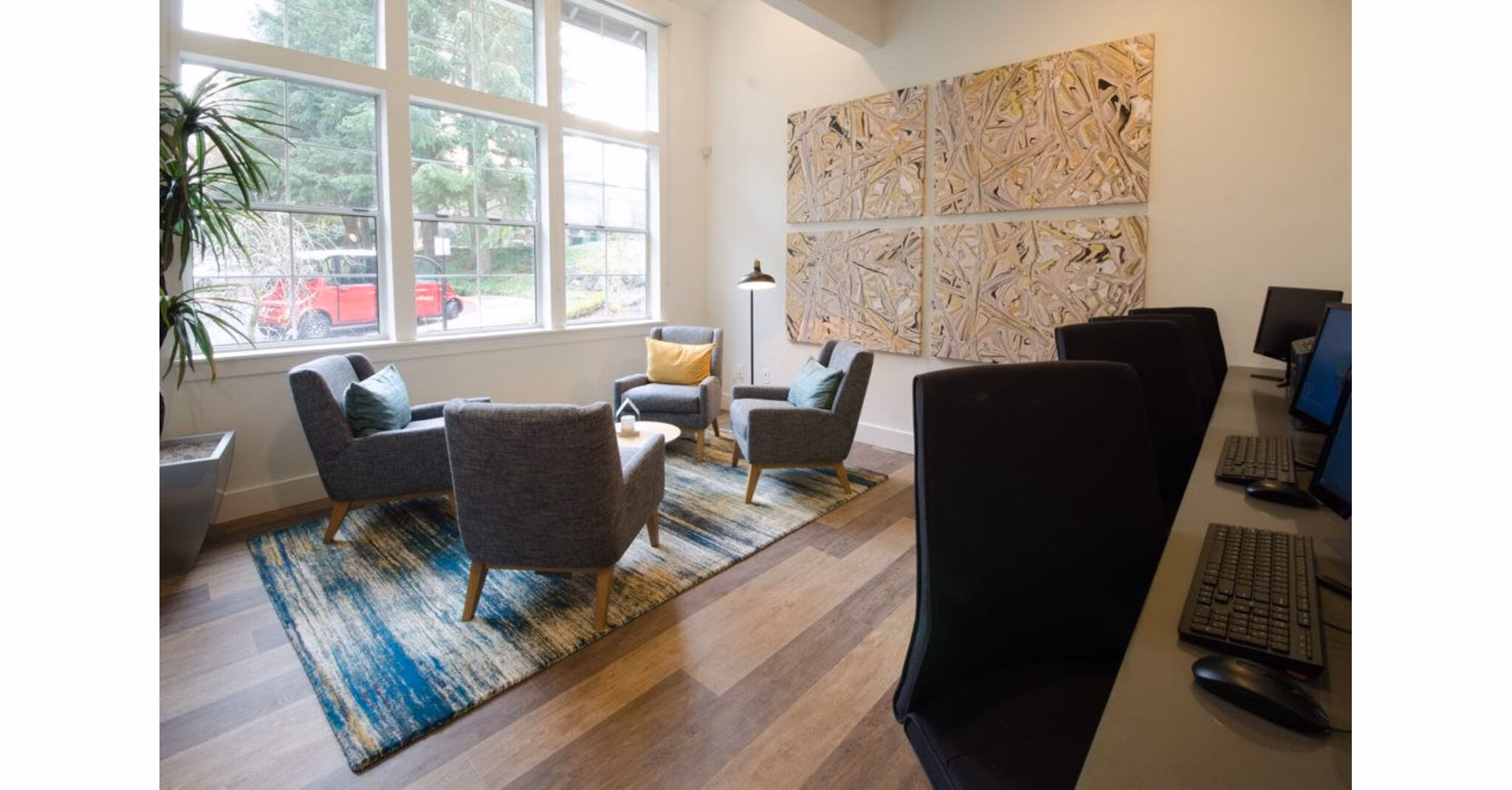 Stylish clubhouse featuring lounge seating and a fireplace at The Fairways Apartments