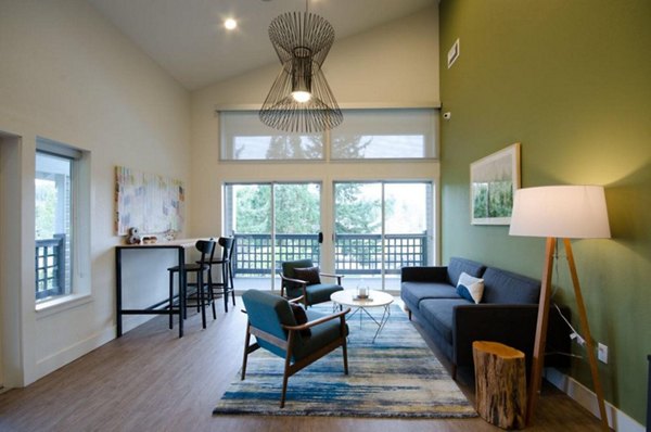Modern clubhouse with lush seating areas at The Fairways Apartments, offering a luxurious experience for residents