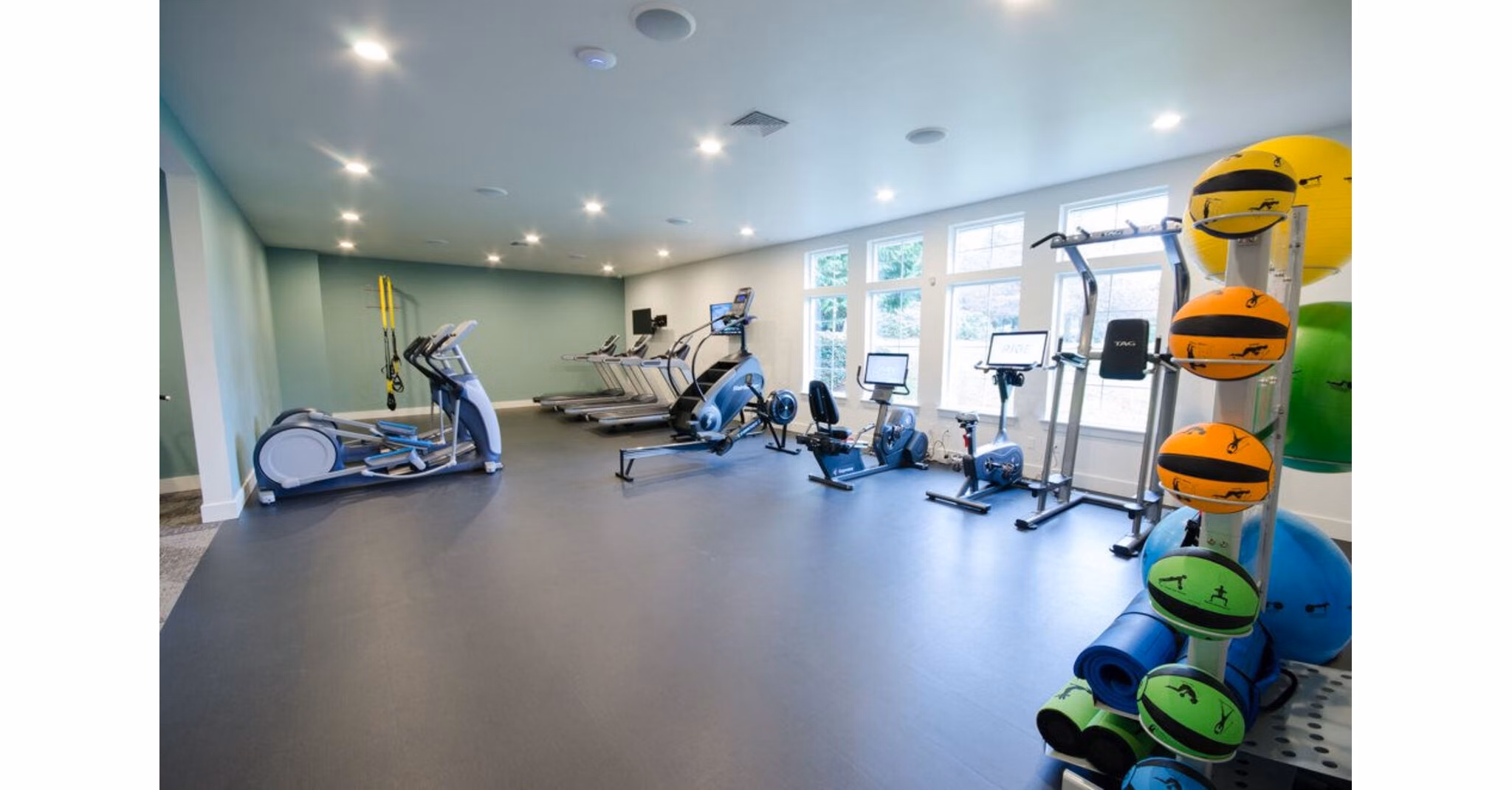 Modern fitness center with state-of-the-art equipment at The Fairways Apartments