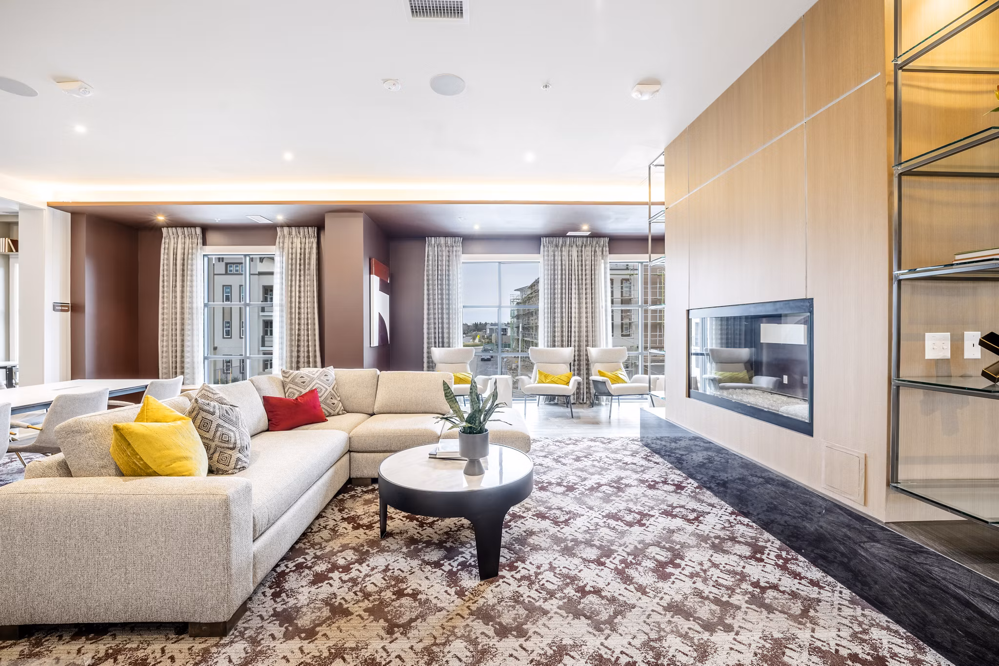 The Core Natomas Apartments: Modern clubhouse with social seating areas and vibrant decor