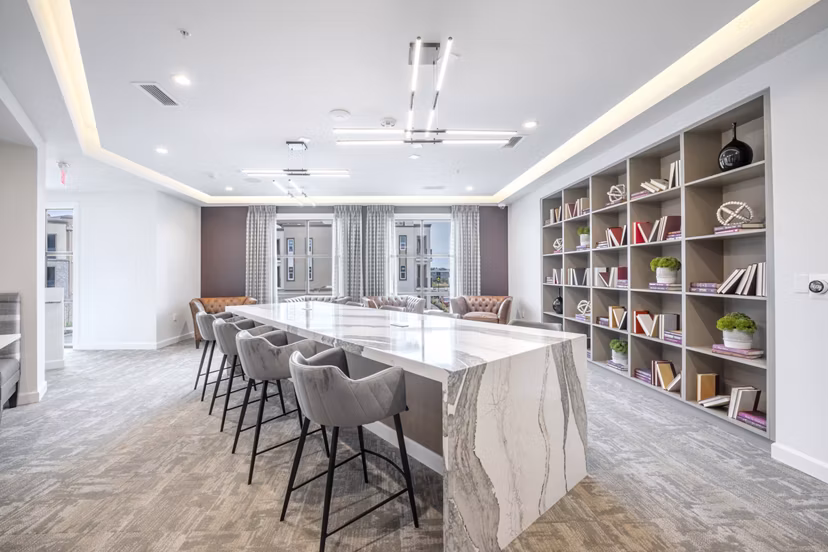 The Core Natomas Apartments: Modern clubhouse with stylish seating and entertainment areas in Sacramento