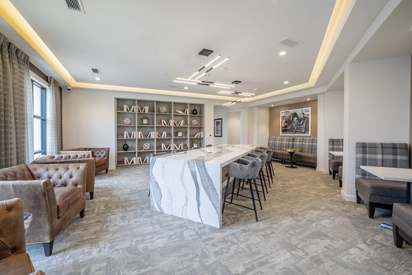 Clubhouse featuring modern design and communal seating at The Core Natomas Apartments