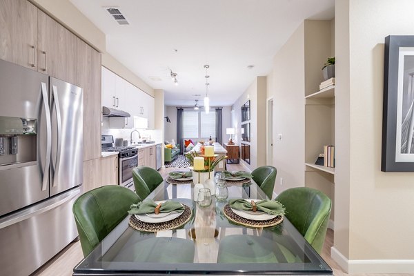 Contemporary dining area with stylish lighting fixtures at The Core Natomas Apartments