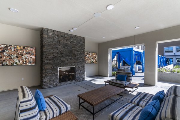 Fire pit with cozy seating at The Core Natomas Apartments, providing a perfect space for relaxing and socializing