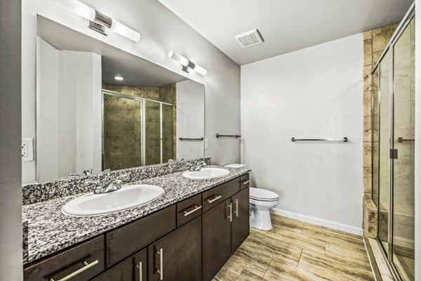 Spacious bathroom with sleek fixtures at Estero Oaks Apartments
