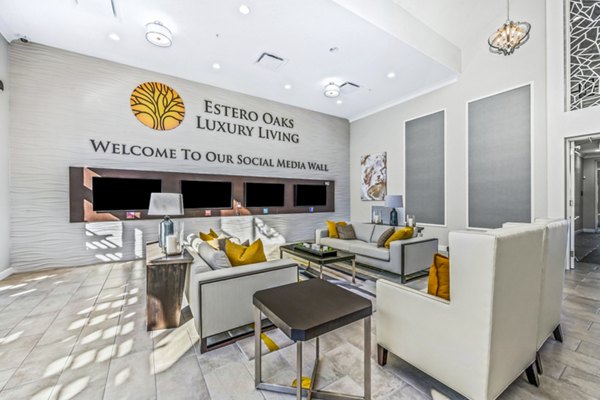 Modern clubhouse featuring a spacious lounge and fitness area at Estero Oaks Apartments