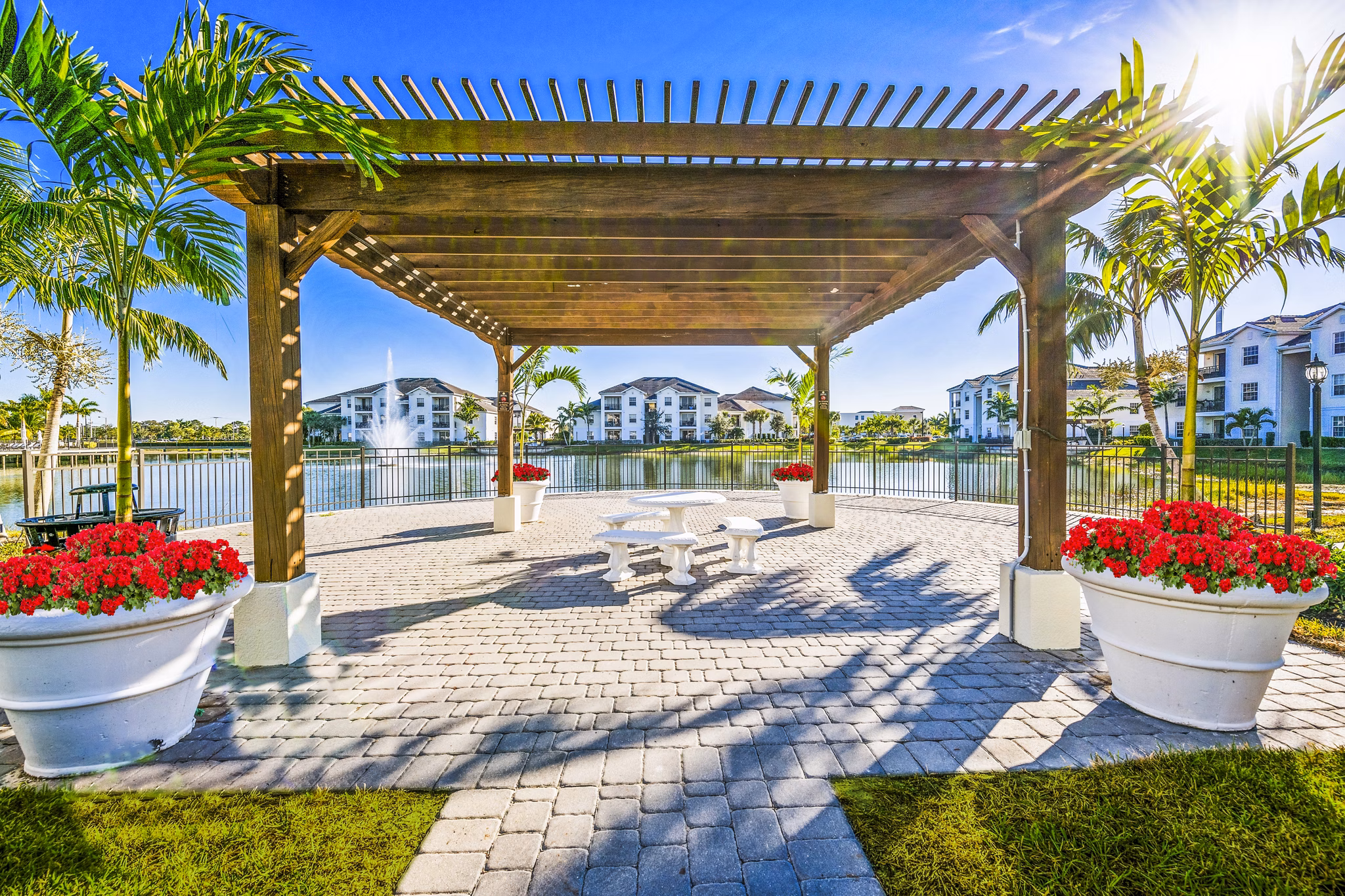 Spacious patio overlooking lush greenery at Estero Oaks Apartments, luxury living in a serene setting