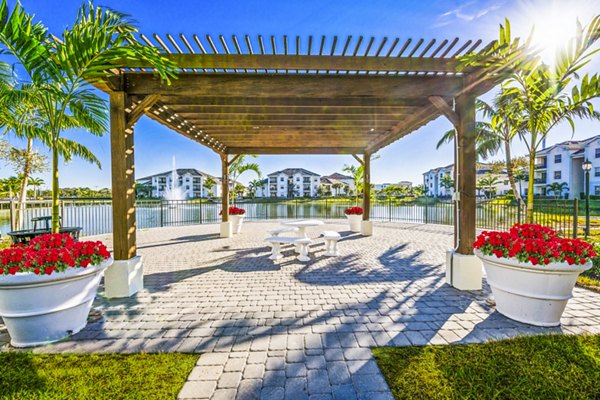 Spacious patio overlooking lush greenery at Estero Oaks Apartments, luxury living in a serene setting