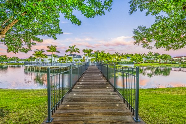 Estero Oaks: Serene view of luxury apartments surrounded by lush greenery in Estero