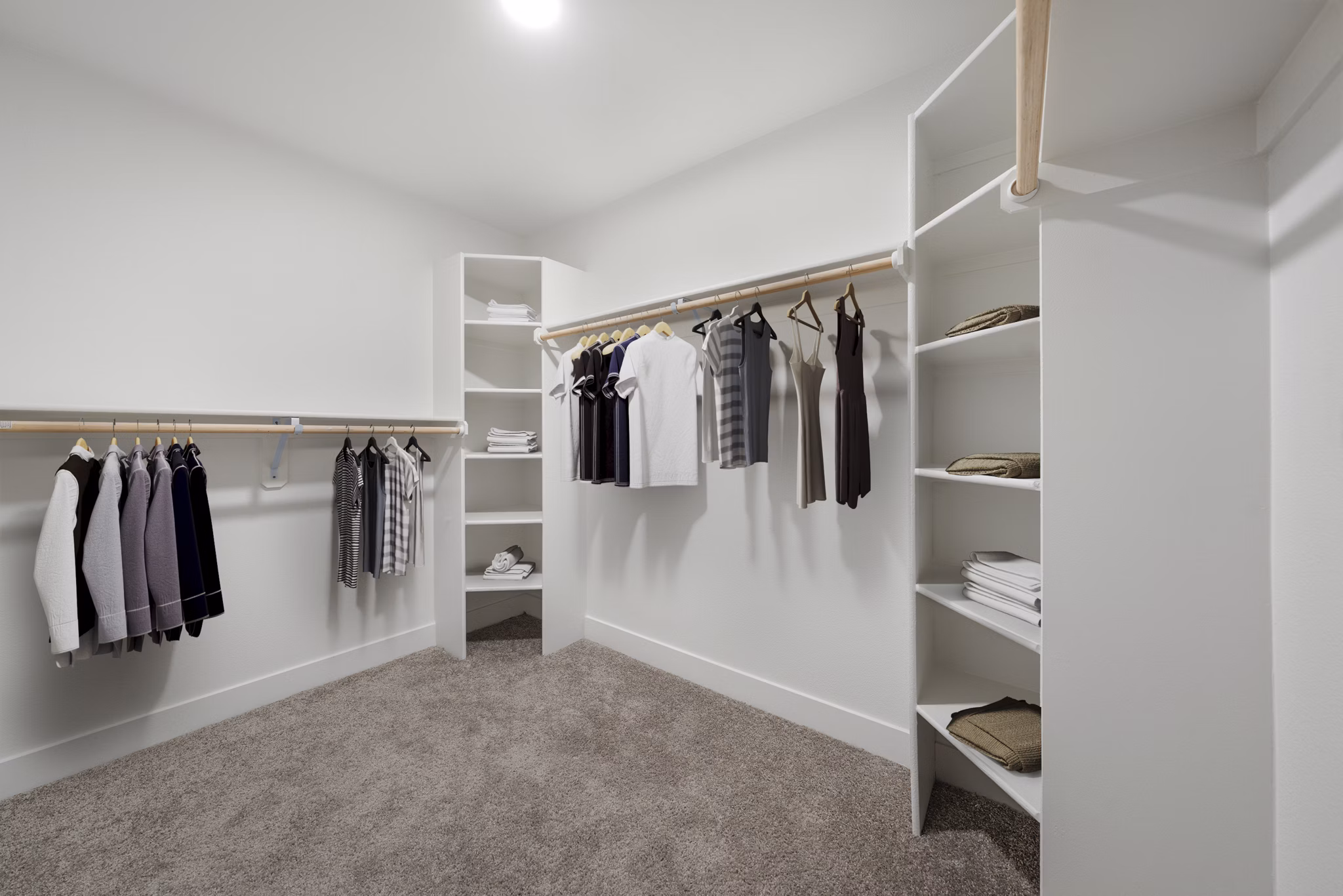 Walk-in closet with ample storage space at Album Marana Apartments