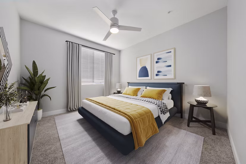Cozy bedroom with modern furnishings at Album Marana Apartments offering luxury living in a Greystar community